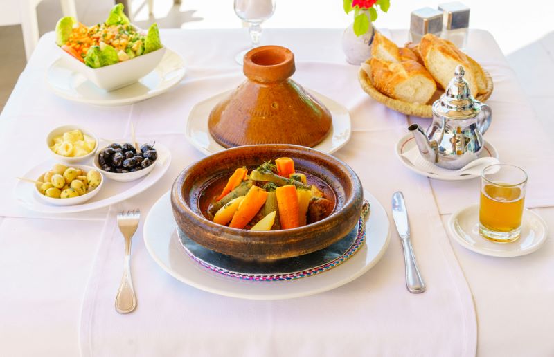 Moroccan-gastronomy-tajin Typical Tajine Moroccan at the Sahara Desert Kam Kam Dunes