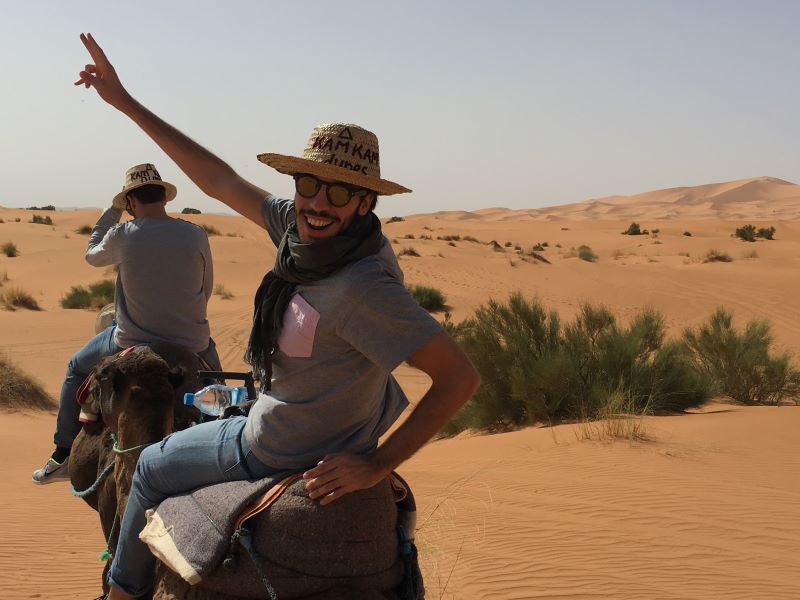 Riding camels in the desert of Morocco 